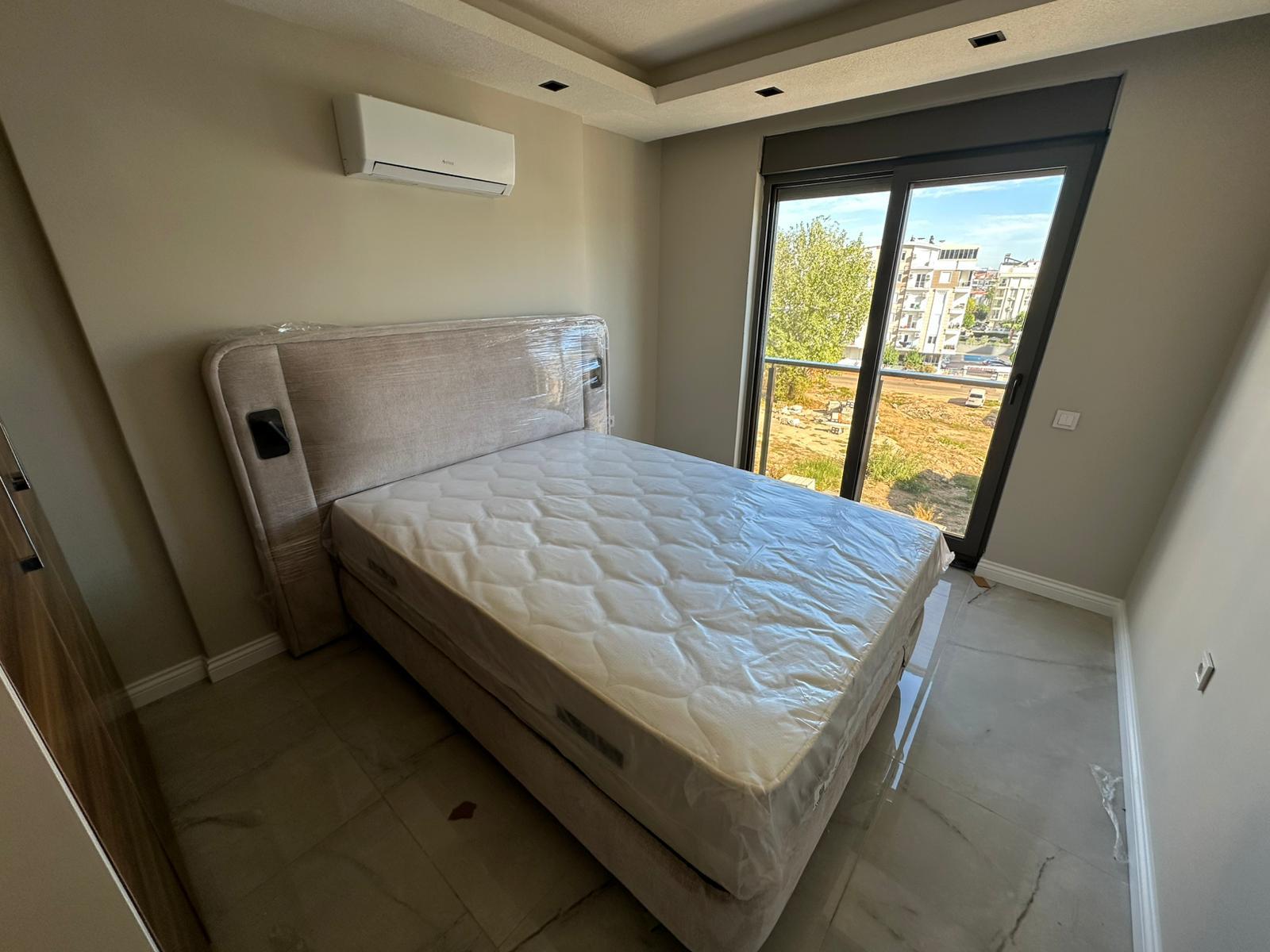 Doğa Park Evleri yatak odası ve balkon görünümü